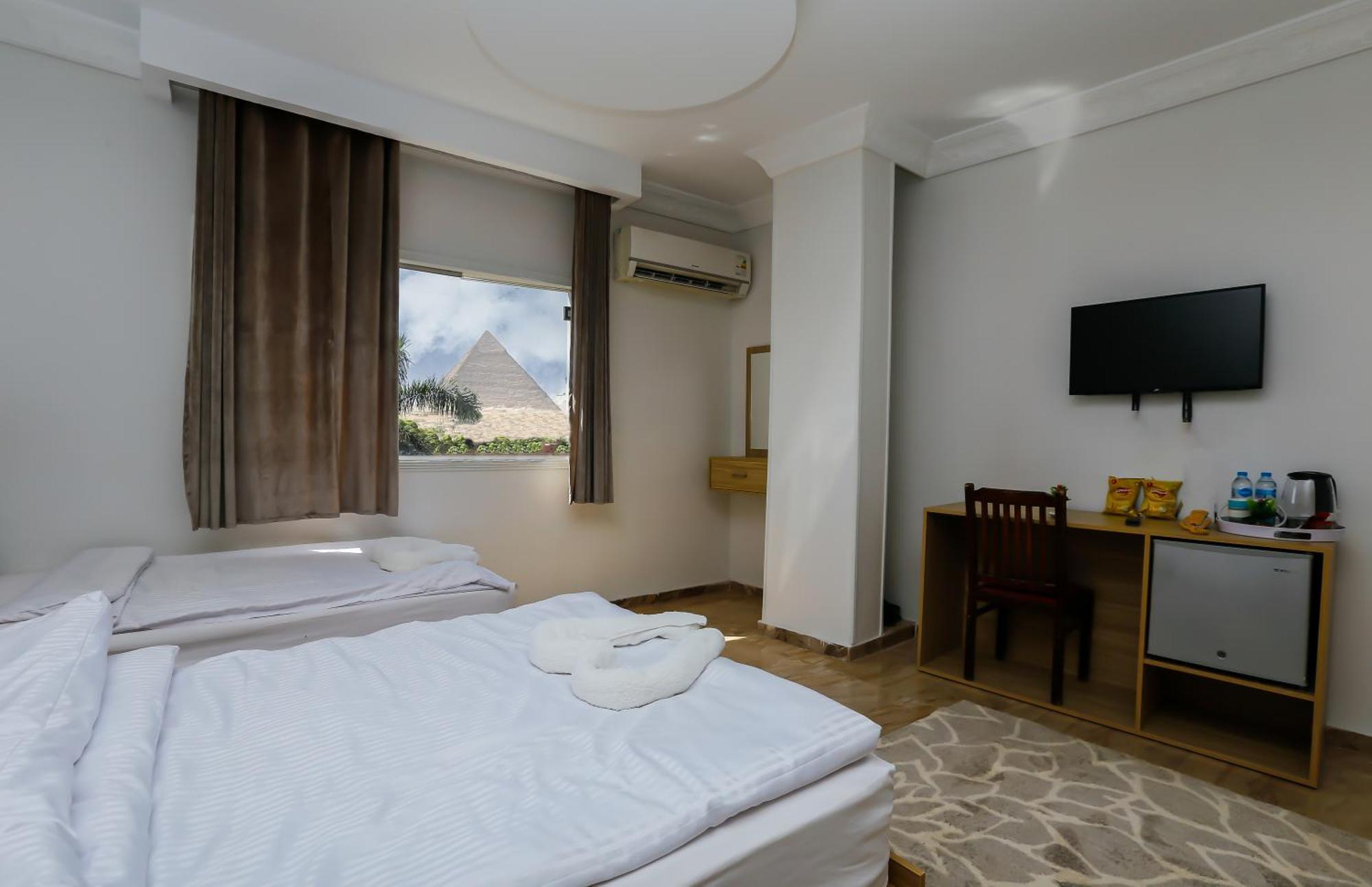 Pyramids Express View Hotel Kafret el-Gabal Esterno foto
