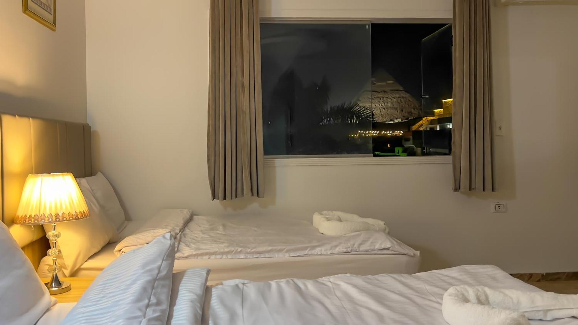 Pyramids Express View Hotel Kafret el-Gabal Esterno foto