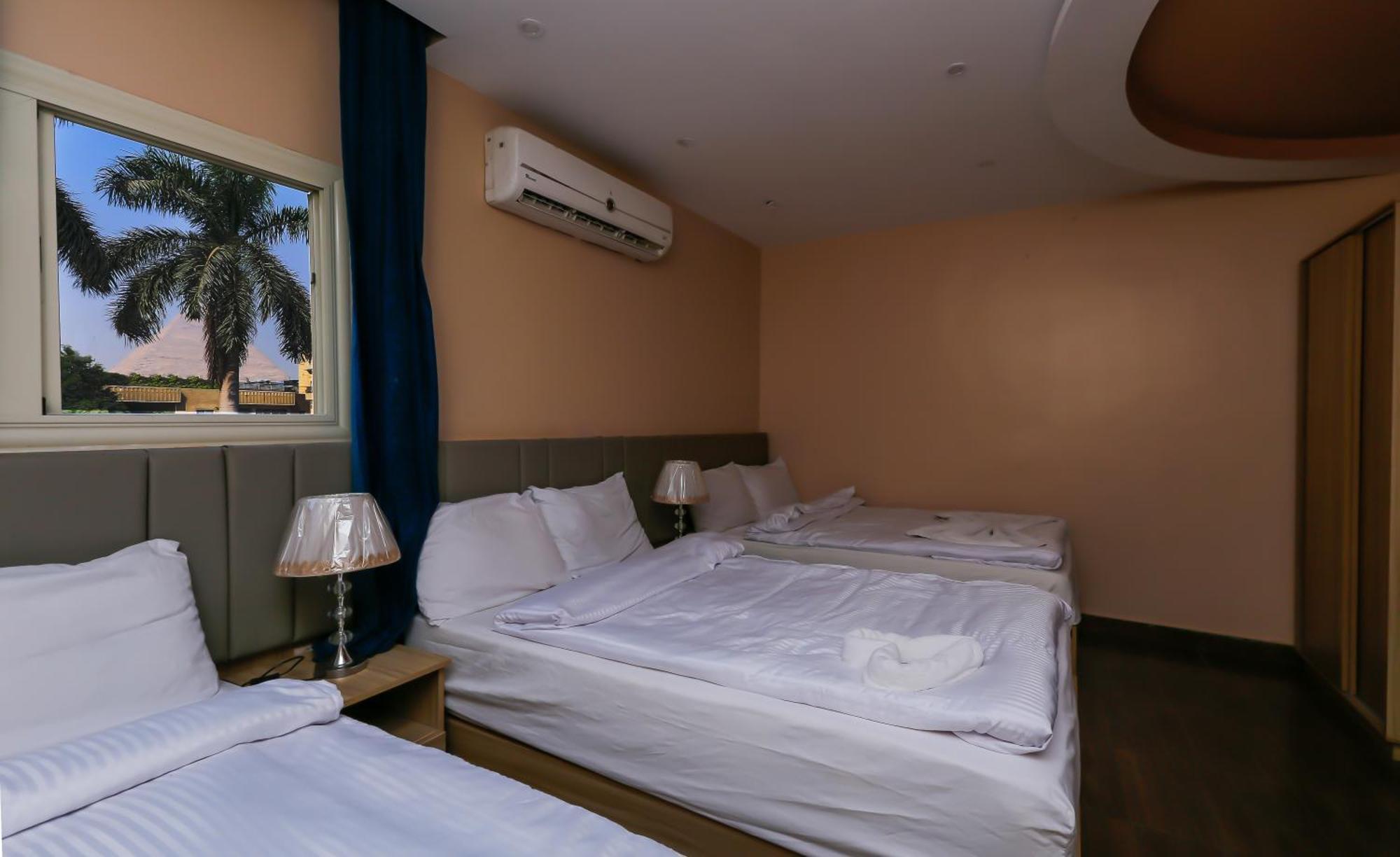 Pyramids Express View Hotel Kafret el-Gabal Esterno foto